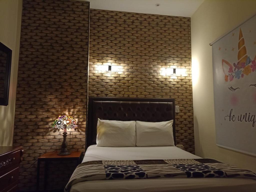 Postel nebo postele na pokoji v ubytování Hotel 50 Suites