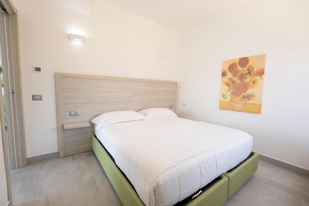 Posteľ alebo postele v izbe v ubytovaní Residenza Timpa Janca