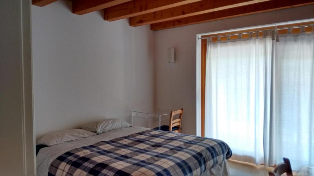 Postel nebo postele na pokoji v ubytování Il giuggiolo