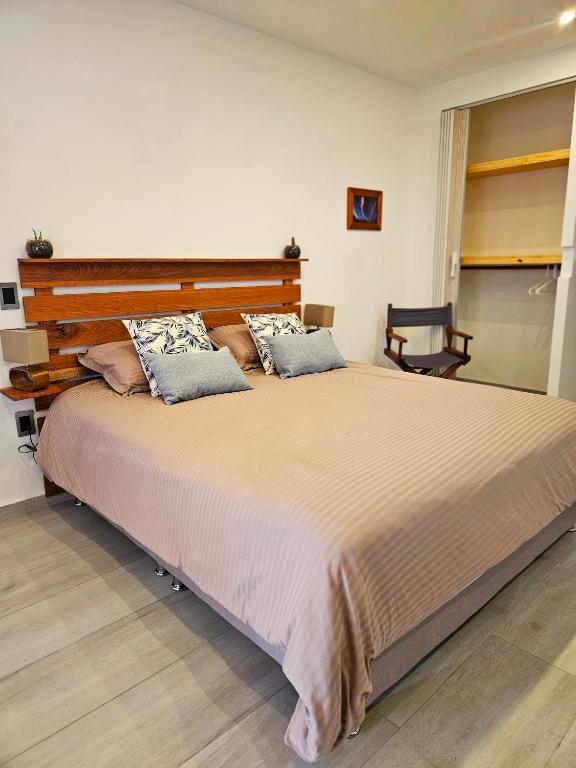 Postel nebo postele na pokoji v ubytování chez yannick Hospedaje Los Amigos