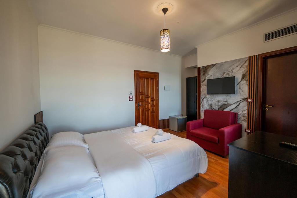 Postel nebo postele na pokoji v ubytování Monte Cristo Hotel - Rooftop Pool
