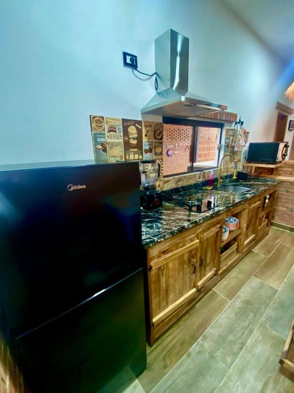 Kuchyň nebo kuchyňský kout v ubytování Cabaña Premium Yvyja de La Mala Junta