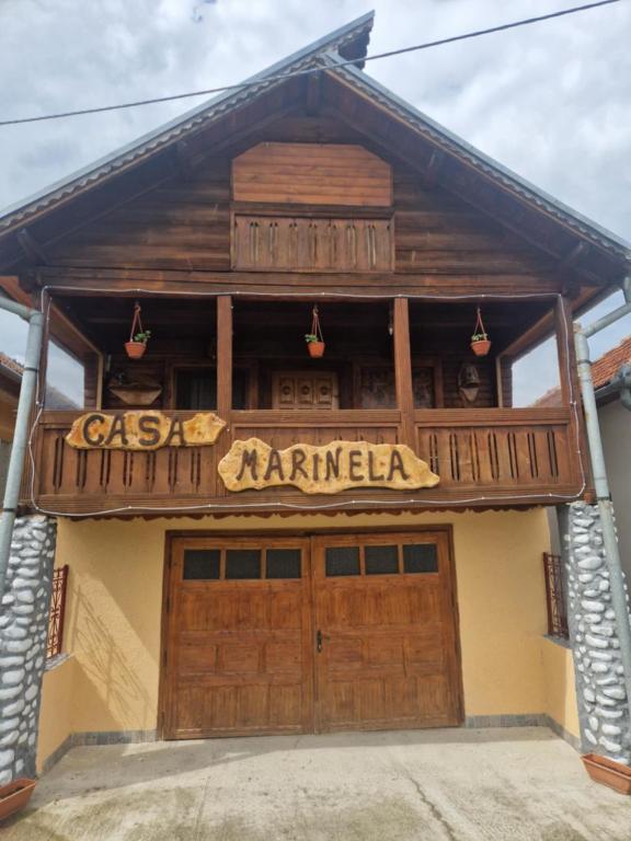 a building with a sign that reads casa maranza at Casa Marinela in Haţeg