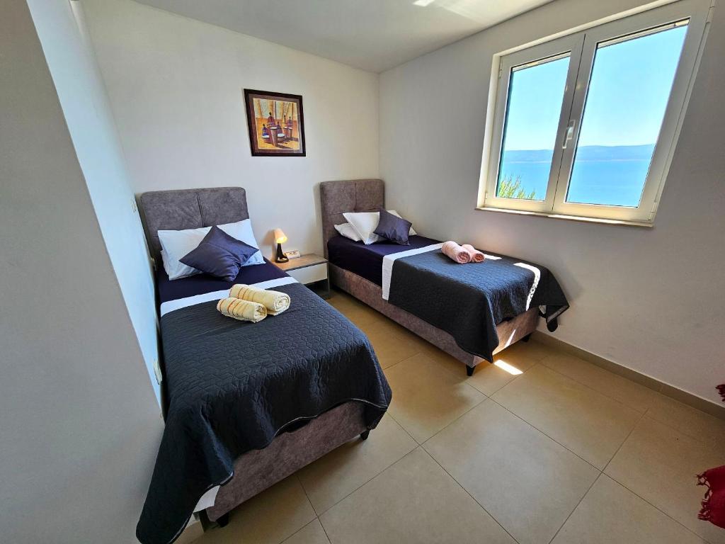 Postel nebo postele na pokoji v ubytování Apartments Liana - VaLa