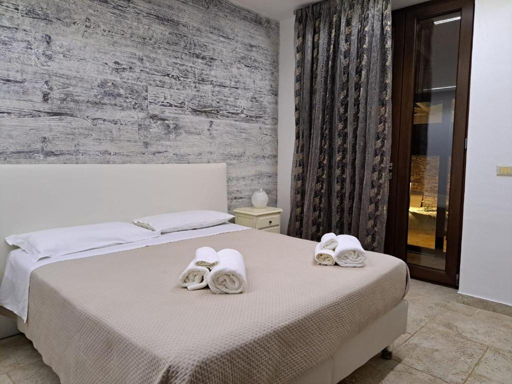 Postel nebo postele na pokoji v ubytování Casale Salento