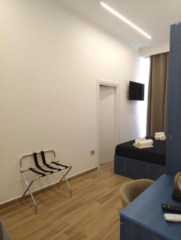 Televízia a/alebo spoločenská miestnosť v ubytovaní Maison Arena