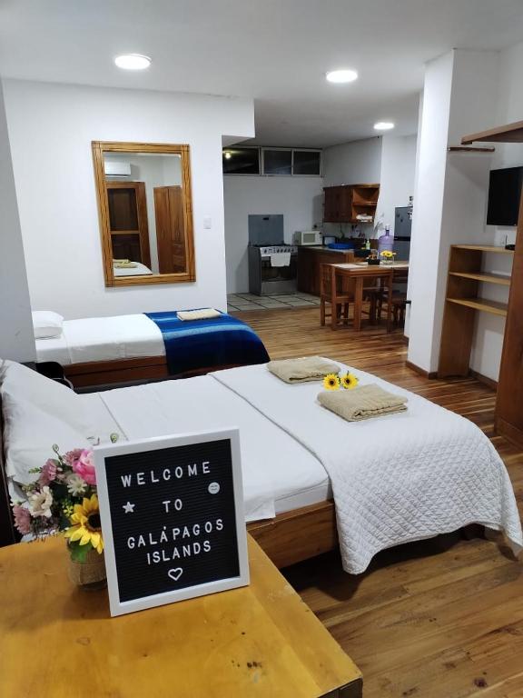 Postel nebo postele na pokoji v ubytování Hostal Darwin