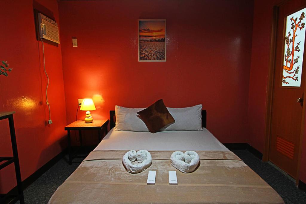 Postel nebo postele na pokoji v ubytování Adrianas Place Boutique Guest House