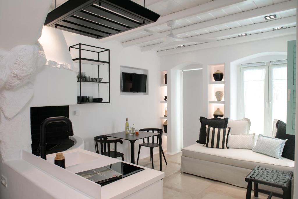 TV a/nebo společenská místnost v ubytování Majo Suites Hotel