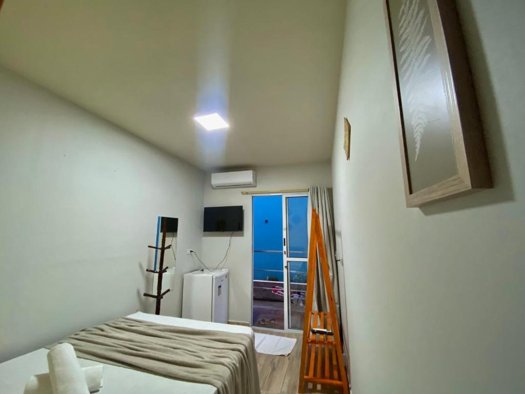 TV a/nebo společenská místnost v ubytování Aloha Oe Itaguá