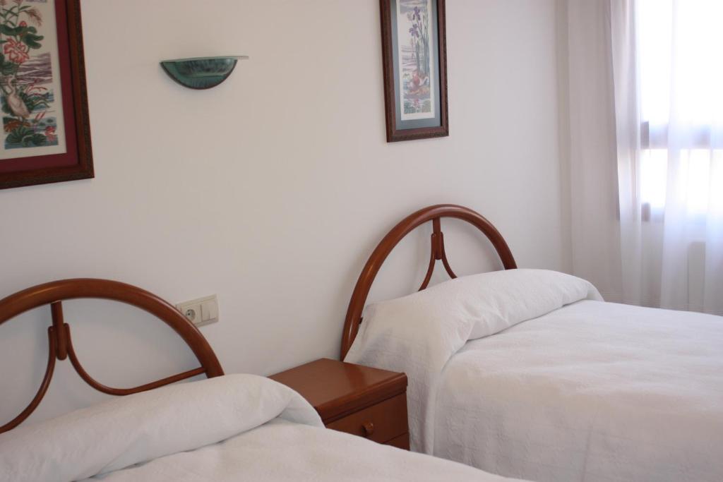 Postel nebo postele na pokoji v ubytování Apartamento Avenida