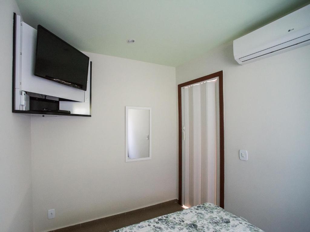 TV a/nebo společenská místnost v ubytování Sweet Rio Residence Taquara