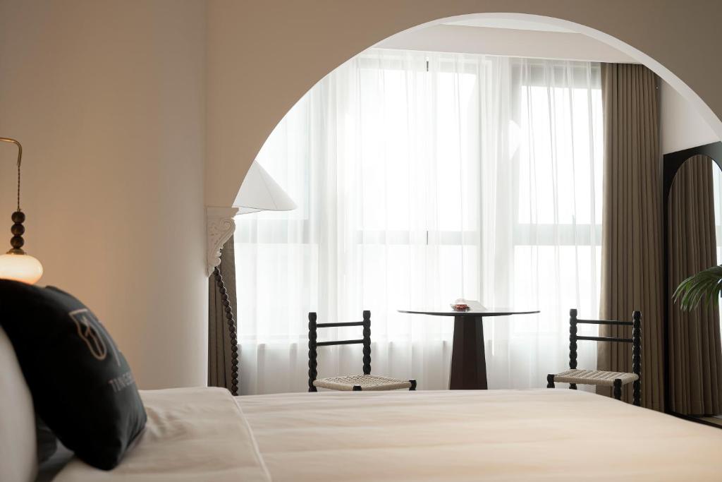 Postel nebo postele na pokoji v ubytování Town Designer B&B