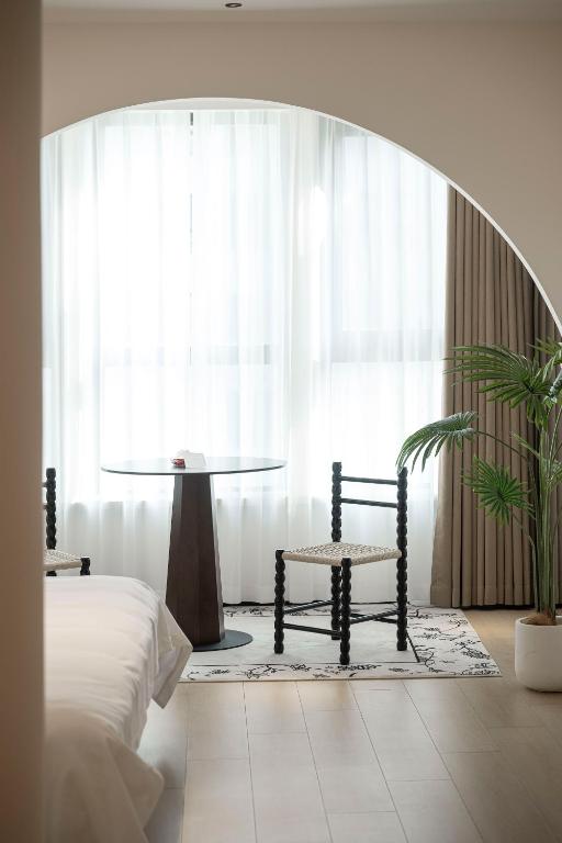 Postel nebo postele na pokoji v ubytování Town Designer B&B