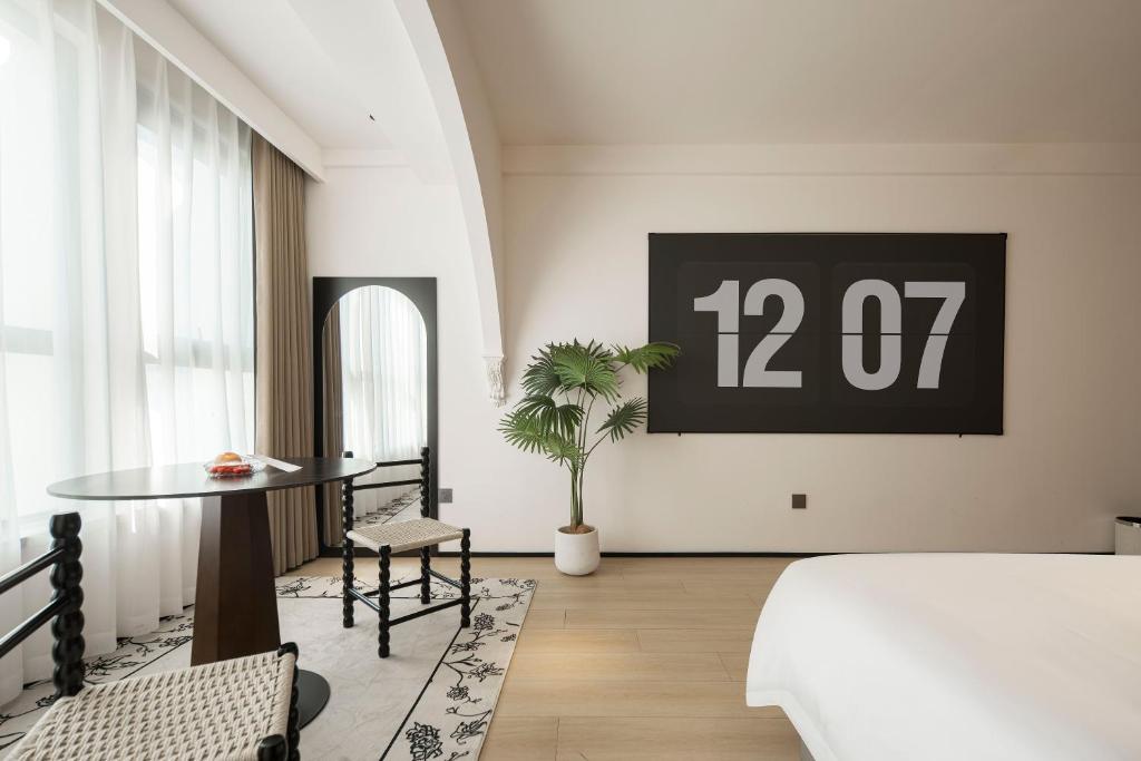 Postel nebo postele na pokoji v ubytování Town Designer B&B