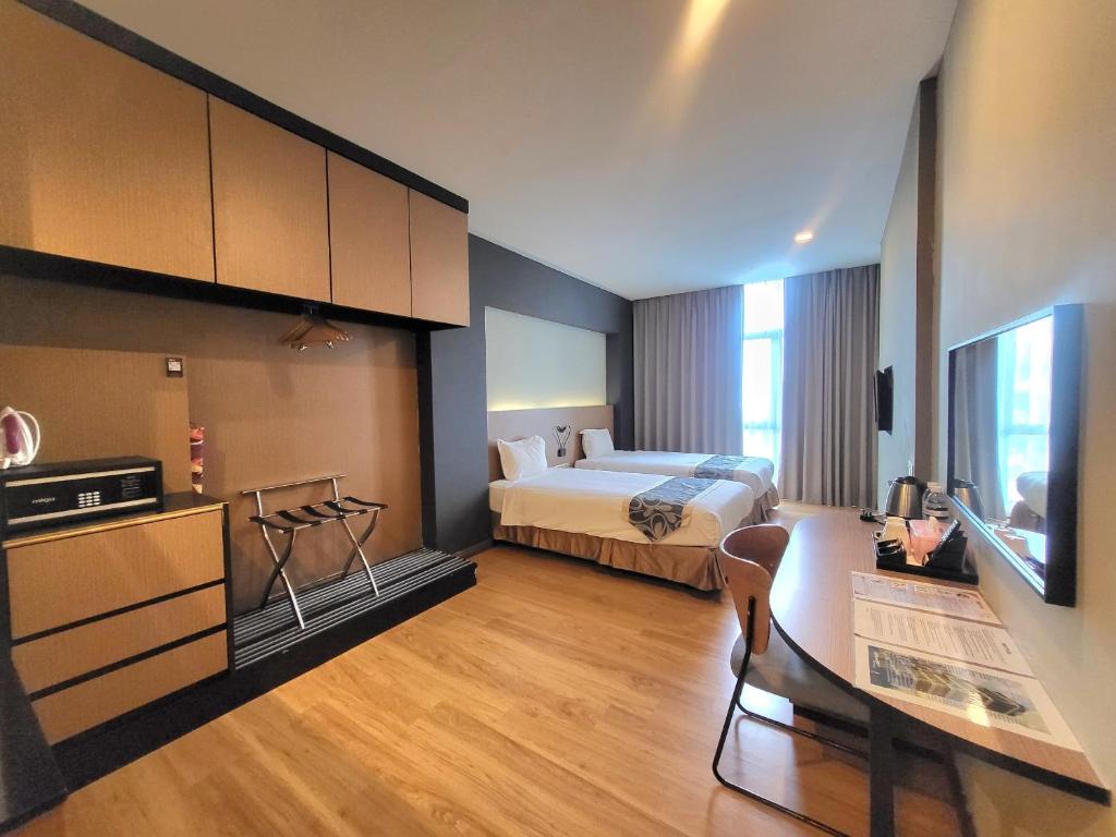 Postel nebo postele na pokoji v ubytování Roxy Hotel & Apartments