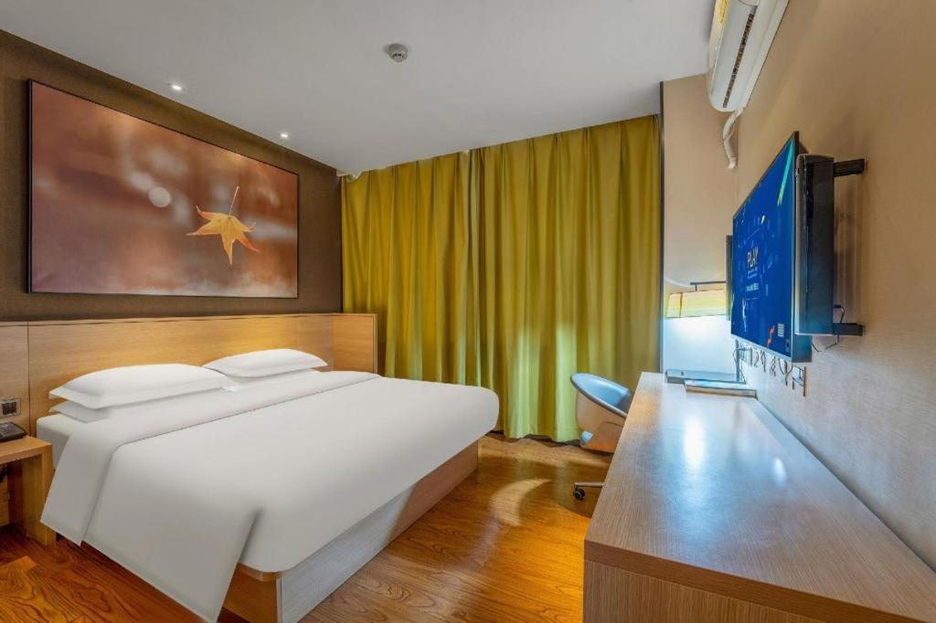 TV a/nebo společenská místnost v ubytování IU Hotels Xinzhou Bus Terminal