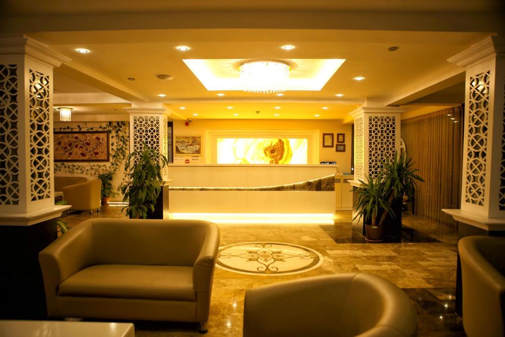 Uma área de estar em Venus Suite Hotel
