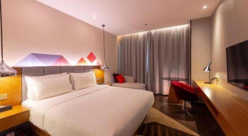 Cama o camas de una habitación en Borrman Hotel Zhanjiang Xuwen Port Terminal
