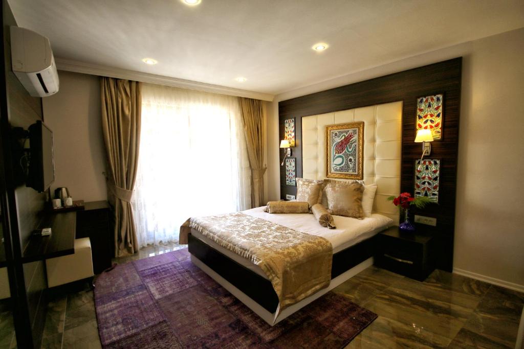 Uma cama ou camas num quarto em Venus Suite Hotel