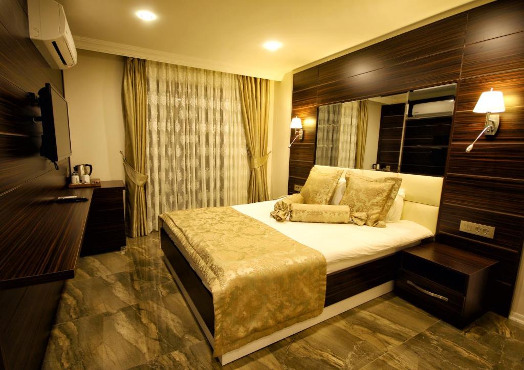 Uma cama ou camas num quarto em Venus Suite Hotel