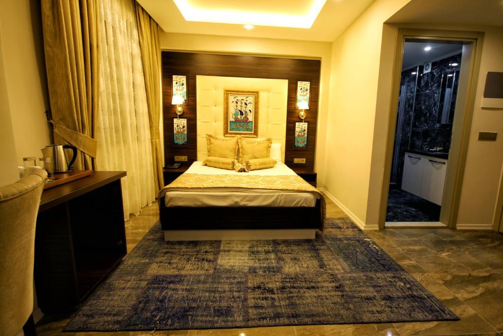 Uma cama ou camas num quarto em Venus Suite Hotel