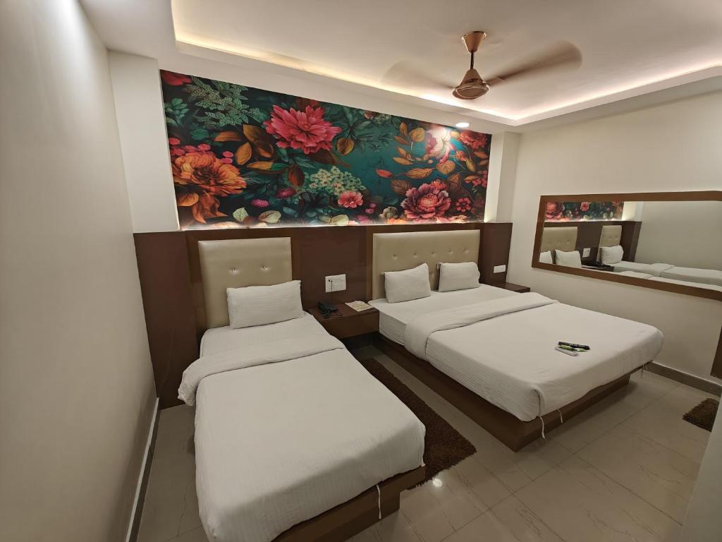 Postel nebo postele na pokoji v ubytování Hotel Apple Villa - New Delhi