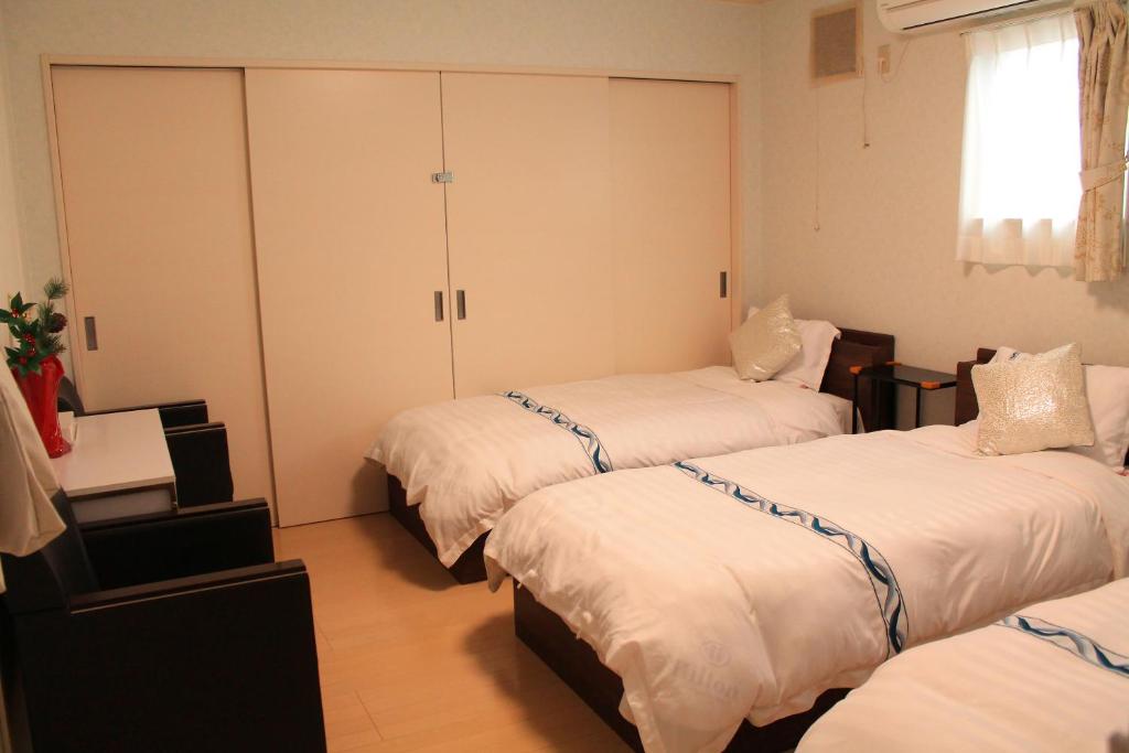 Postel nebo postele na pokoji v ubytování 山中湖リゾートハウス
