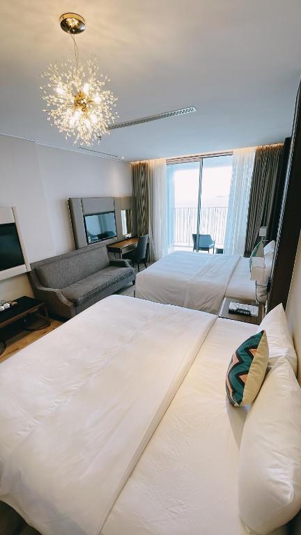 Giường trong phòng chung tại Panorama Apartment NHA TRANG