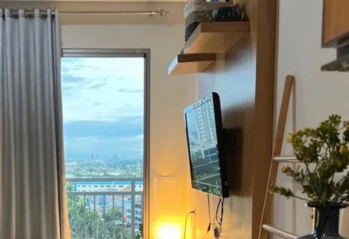 TV a/nebo společenská místnost v ubytování Springwood Residences by Kakarama Room