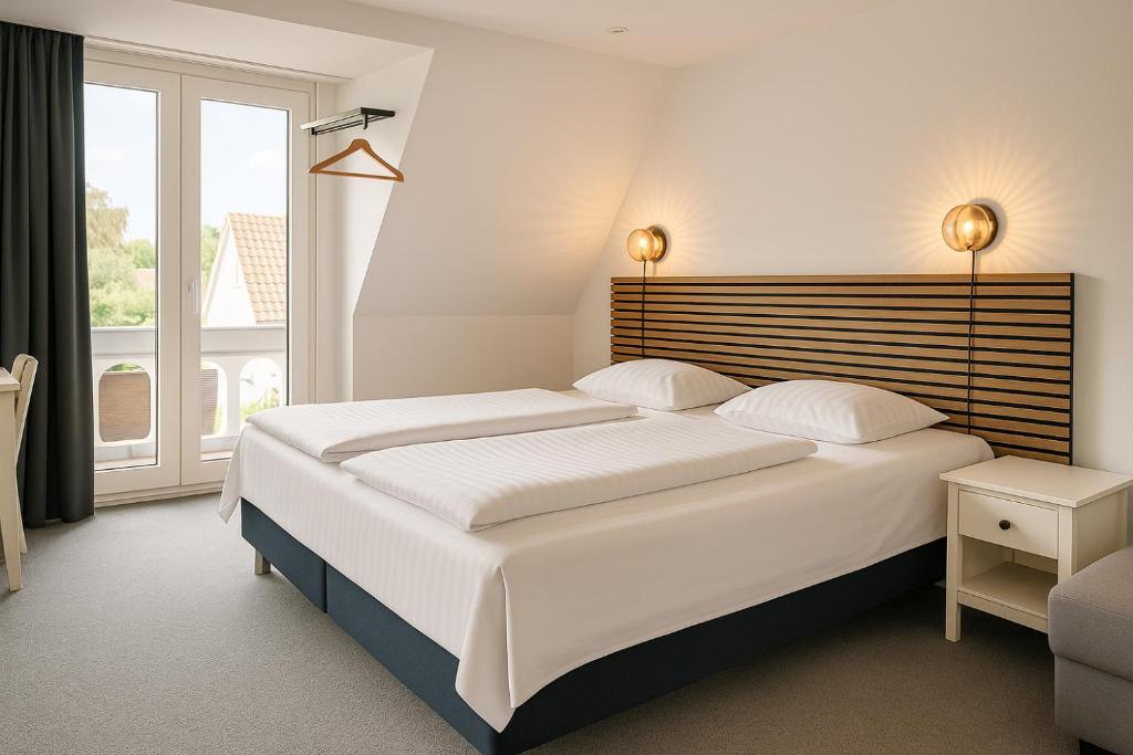 Postel nebo postele na pokoji v ubytování CentralHotellet