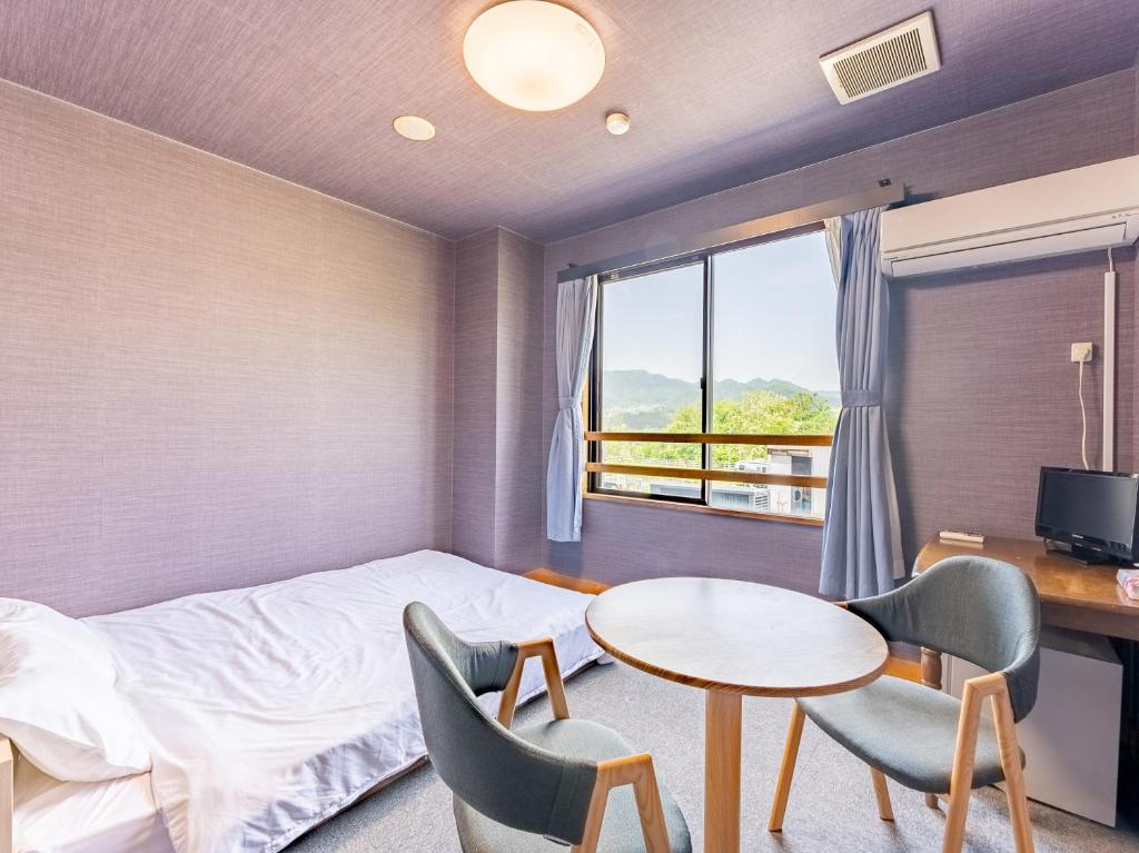 Postel nebo postele na pokoji v ubytování RV park plus Numata Kenko Land