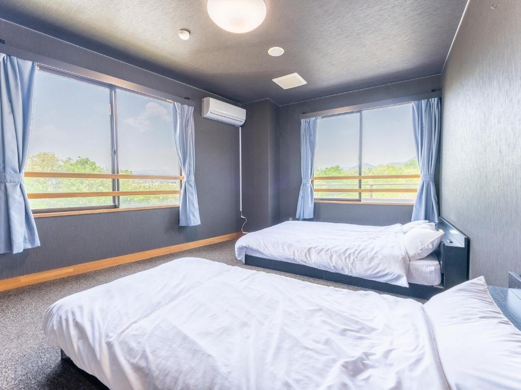 Postel nebo postele na pokoji v ubytování RV park plus Numata Kenko Land