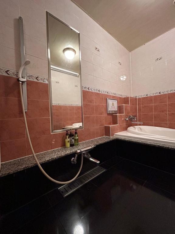 Koupelna v ubytování Hotel Takao Asile