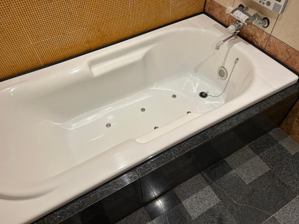Koupelna v ubytování Hotel Takao Asile