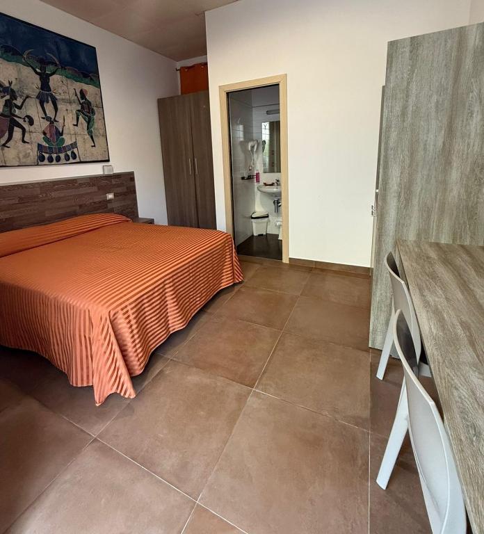 Postel nebo postele na pokoji v ubytování Hotel Miramare Dipendenza