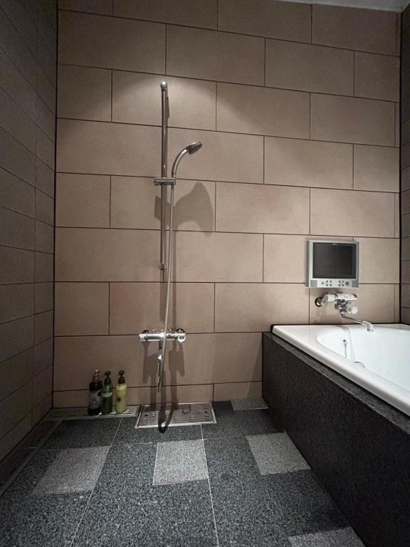 Koupelna v ubytování Hotel Takao Asile