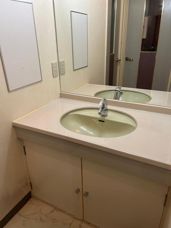 Koupelna v ubytování Hotel Takao Asile