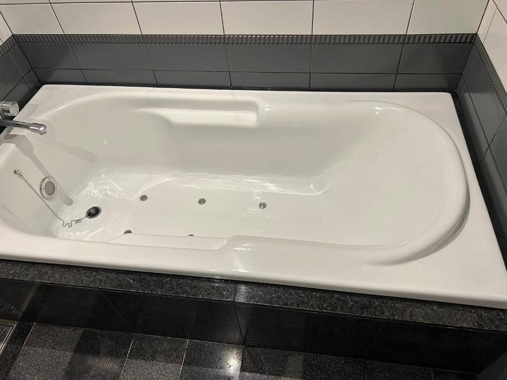 Koupelna v ubytování Hotel Takao Asile