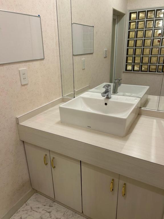 Koupelna v ubytování Hotel Takao Asile