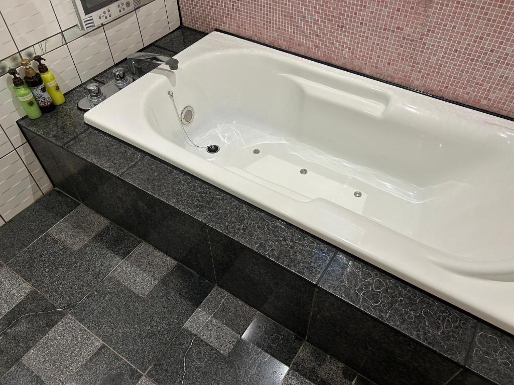Koupelna v ubytování Hotel Takao Asile