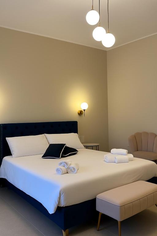 Postel nebo postele na pokoji v ubytování Maison ì room & suites