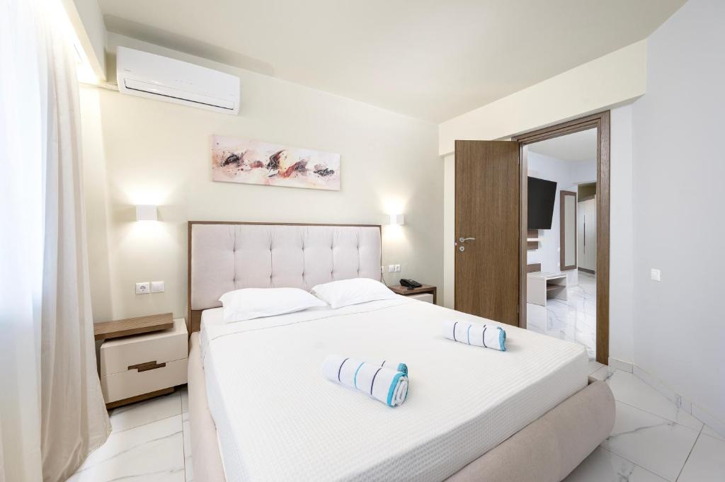 Postel nebo postele na pokoji v ubytování Harmony Rethymno Beach