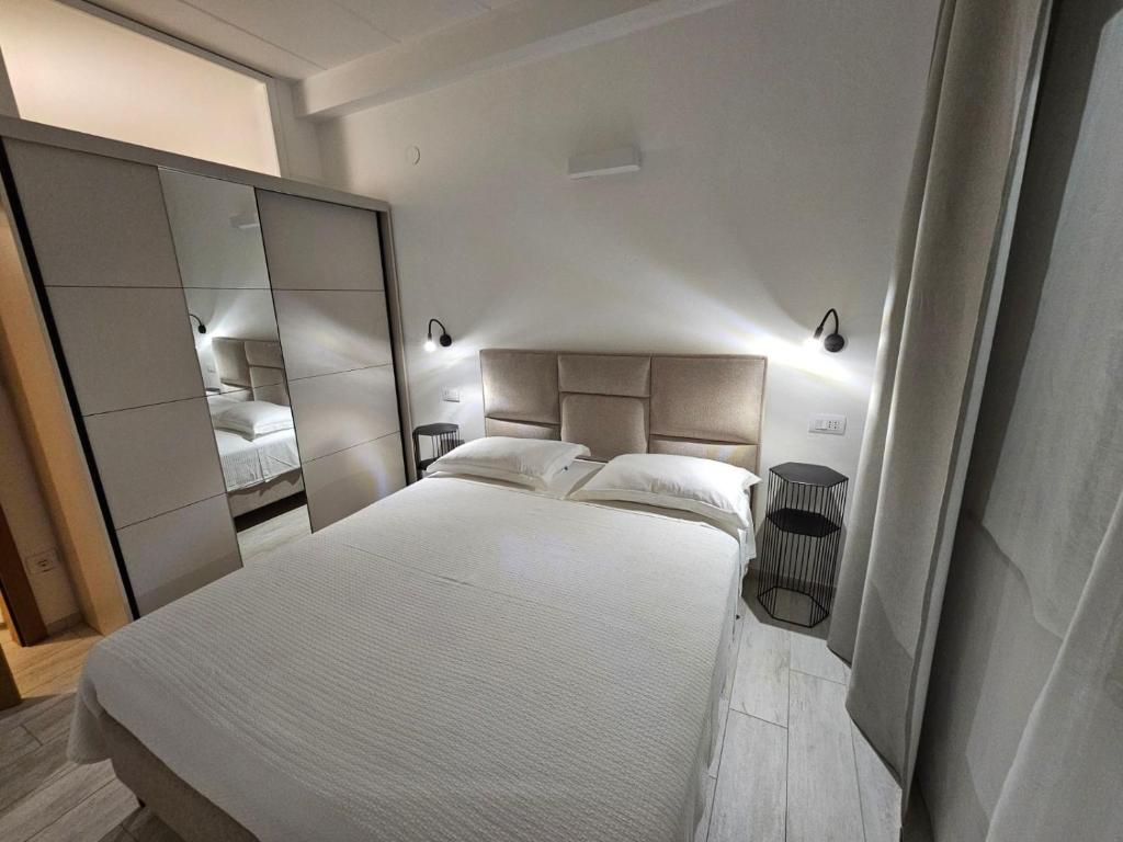 Łóżko lub łóżka w pokoju w obiekcie Apartments Cocaletto5