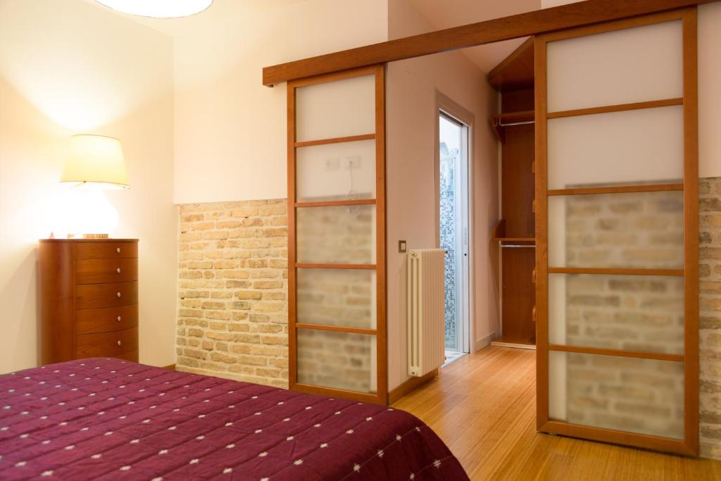 A bed or beds in a room at Guest House Le Acacie