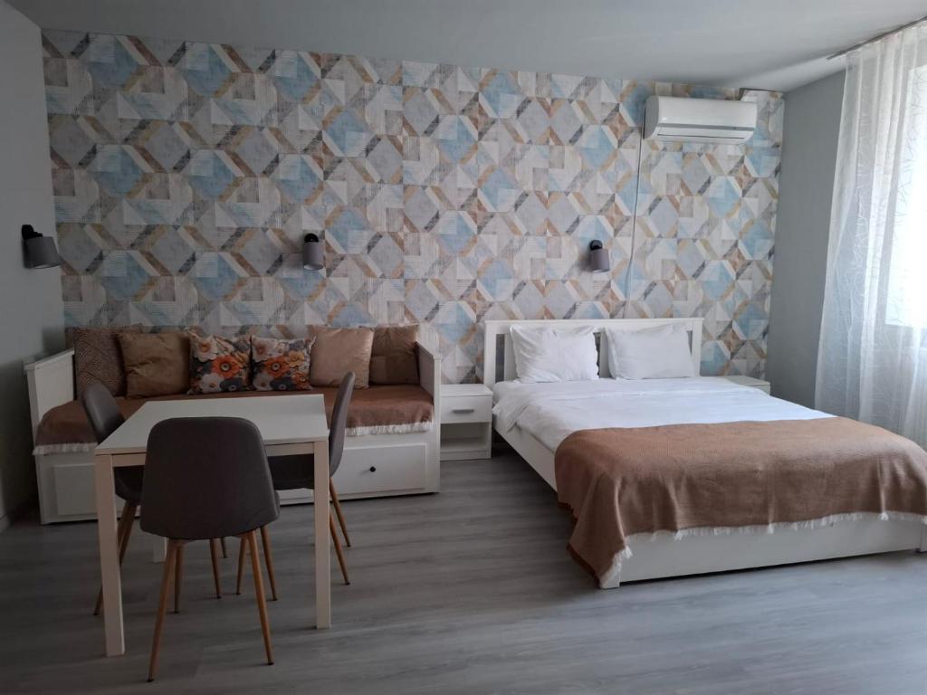 En eller flere senge i et værelse på Pensiunea Paloma 3 stele Brasov