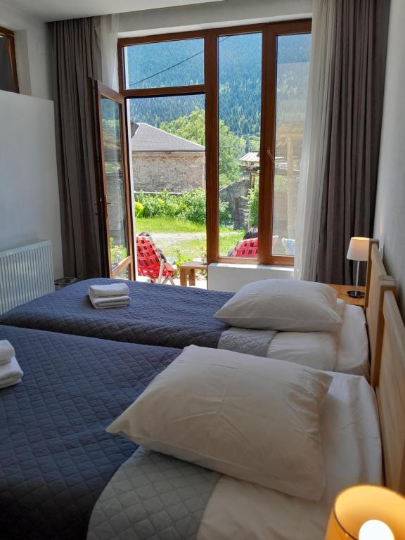 Postel nebo postele na pokoji v ubytování Bapsha Guesthouse