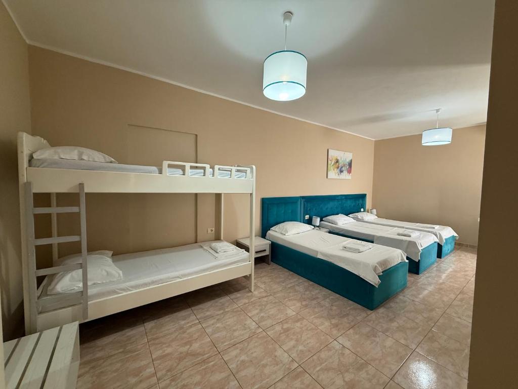 Postel nebo postele na pokoji v ubytování AMĀIA Hotel & Restaurant