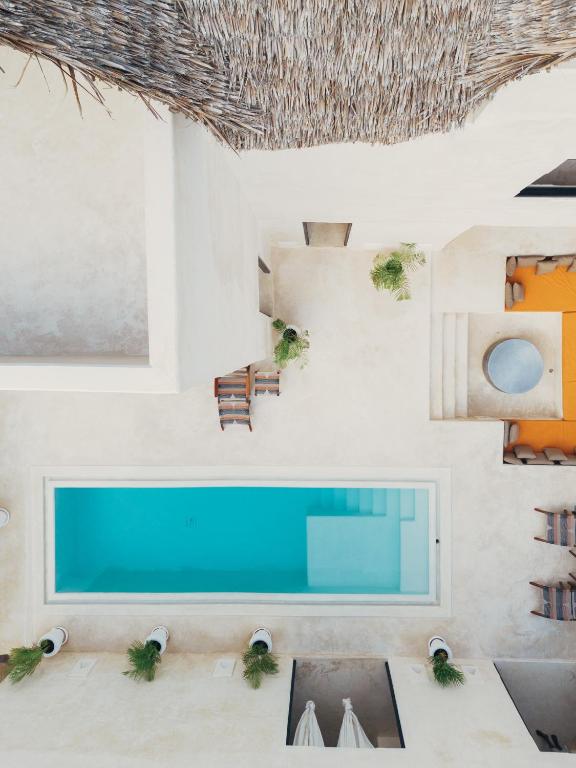 Posezení v ubytování Tulia House Lamu