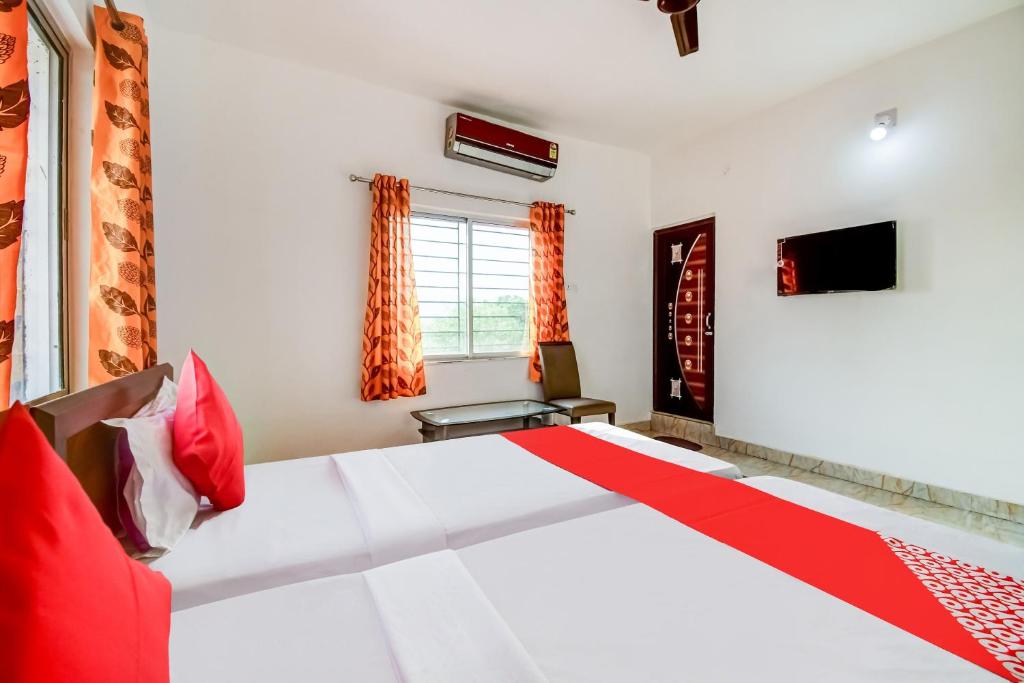 Postel nebo postele na pokoji v ubytování Hotel O Creation Premium